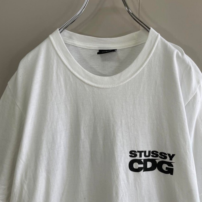 STUSSY ✖️ CDG sarfman backprint T-shirt size M 配送C ステューシー　サーフマン　バックプリントTシャツ　白 | Vintage.City 빈티지숍, 빈티지 코디 정보